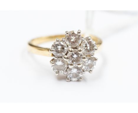 A diamond flower head cluster ring, set with eight round brilliant cut diamonds with a total gross weight approx 1.46 carats,