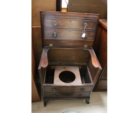 A Georgian commode in the form of a chest.