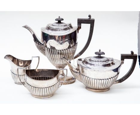 A George V silver tea &amp; coffee service Georgian style with gadroon lower sections, ebonised handles, comprising teapot, c