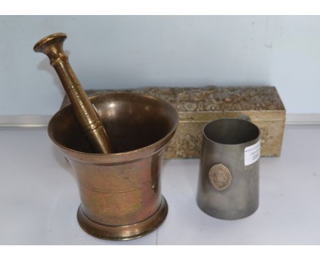 A Brass Mortar and Pessel 12cm in height, no markings: an Oriental base metal box 28cm in length with silver finish and embos