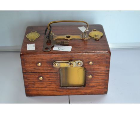 A 1950's unusual oak cased and brass internal, key, pigeon clock by the maker Jundes Thexor