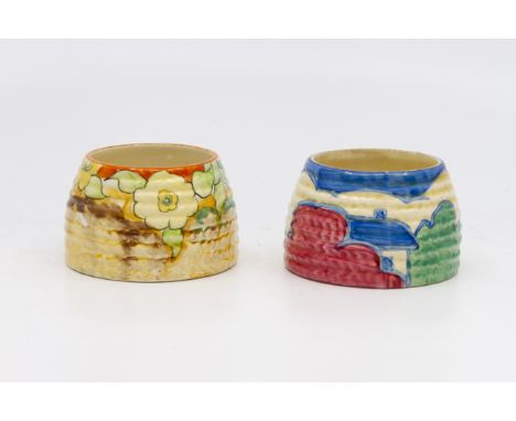 Clarice Cliff for Newport Pottery, a small Jonquil beehive honey pot, lacking lid, Bizarre mark together with another: Claric