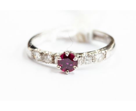 An 18ct white gold, diamond and ruby ring, size Q, gross weight approx 3.7gms