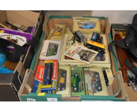 A box of die-cast model vehicles - mostly in original boxes 