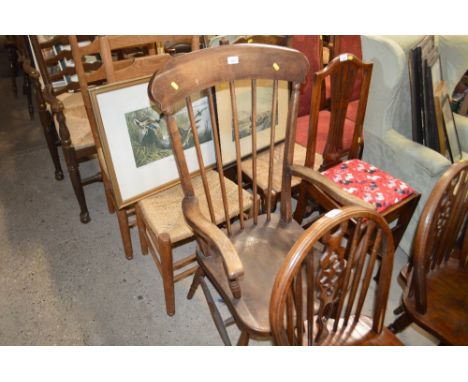 An elm seated stick back elbow chair