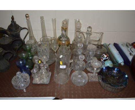 A quantity of 19th Century and later glassware to include decanters, a Carnival glass bowl, vases, etc.