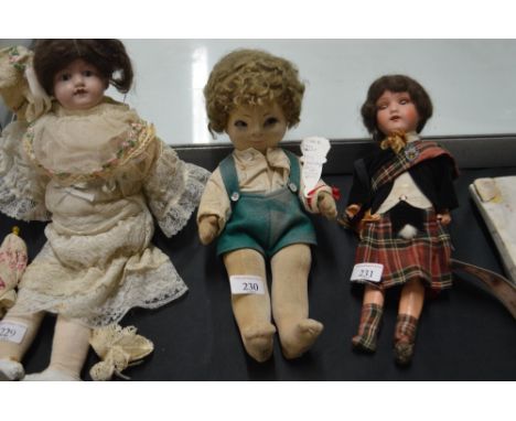 A Chad Valley jack doll with glass eyes