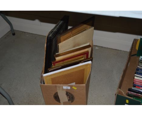 A box of various pictures and prints