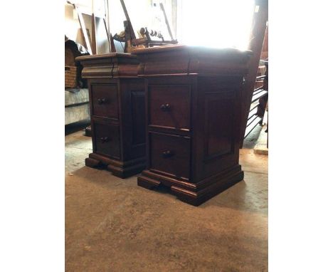 A Pair of mahogany bedside chests, with moulded tops over cushion drawer and two drawers under, raised on bracket supports H6