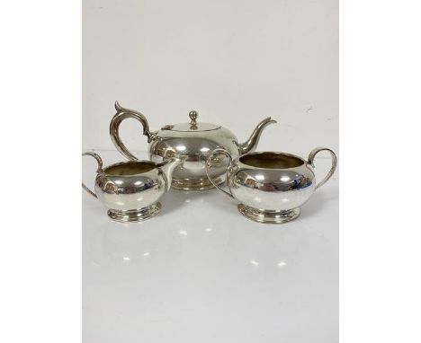 An Epns three piece tea service complete with cream jug and sugar basin, with teapot