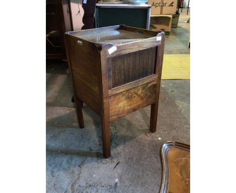 A 19th century mahogany night commode, the tray top with pierced handles over a tambour fronted cupboard, raised on square su