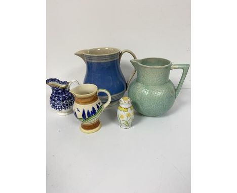 A 19thc pottery blue banded jug, a Kensington green 30s style jug, a Royal Doulton Clarice Cliff inspired jug,  a blue and wh