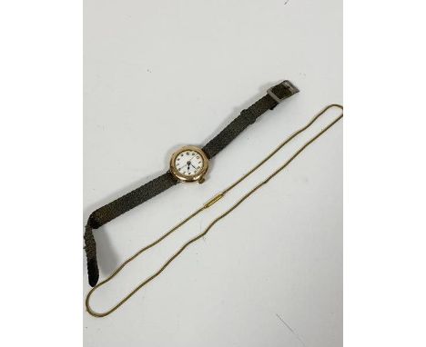 A 9ct gold cased lady's 1920s style wristwatch with enamel dial (a/f) and roman numerals, on woven strap (d.2.5cm) and a fine