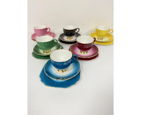 A Stanley china harlequin tea service with spotted enamelled decoration comprising six cups, six side plates and six saucers 