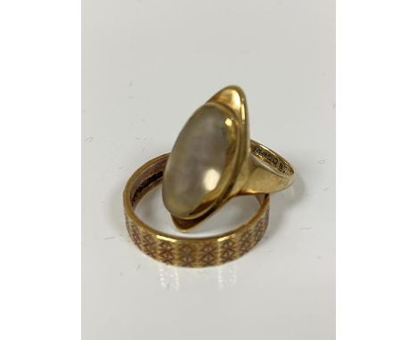 A 9ct gold navette shaped moonstone ring mounted in rubover setting (J/K) and a 9ct gold engraved band (P/Q)