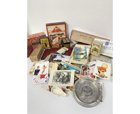 A collection of humerous and pictorial postcards, Monopoly game, various card packs, cigarette cards, playing cards etc. (a l