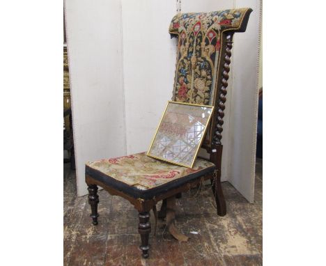 A Victorian rosewood framed prie-dieu, with original hand worked tapestry seat and back, with Gothic style detail and trailin