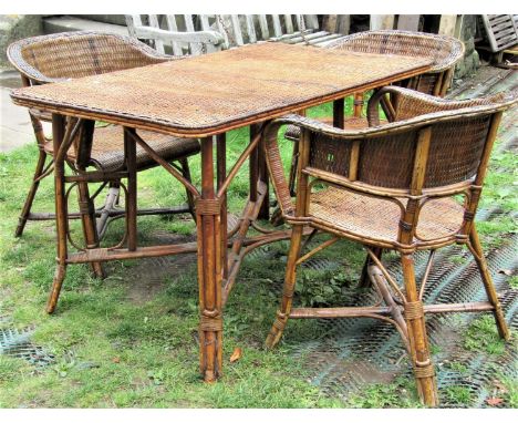 A vintage cane work table with wicker work top, together with three matching tub chairs, the table 125 x 75cm 