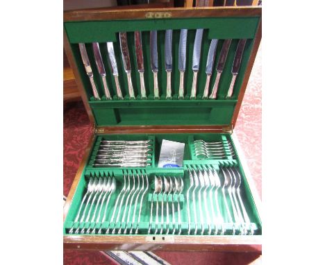 A vintage walnut veneered case of silver plated kings handle flatware 