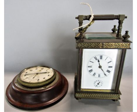 Good brass cased carriage clock with architectural case work with pierced diaper bands, enamelled dial with subsidiary second