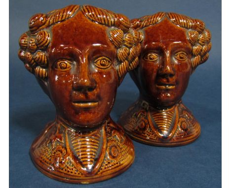 A pair of early 19th century treacle glazed sash window supports modelled as female heads, 12cm tall approx (pair) 