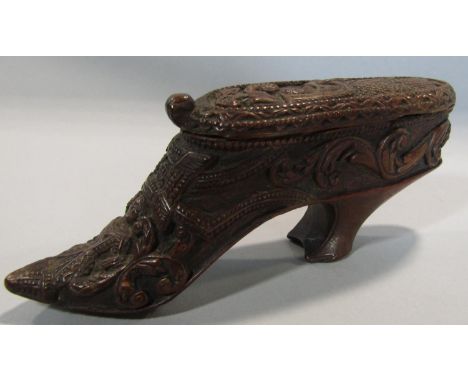 A good antique treen snuff box in the form of a ladies shoe 12 cm, pipe casing 29 cm, profusely carved with ladies, cornucopi