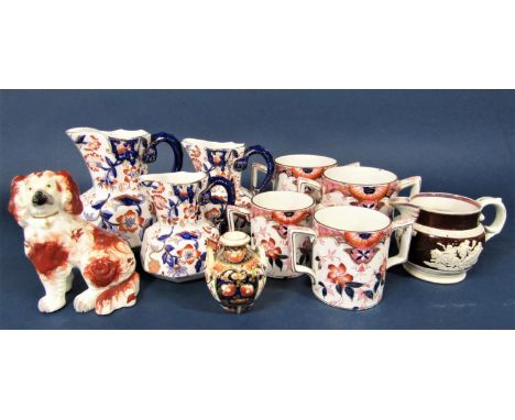 A 19th century Staffordshire spaniel with red painted patches and separate forelegs, a graduated set of three 19th century ju