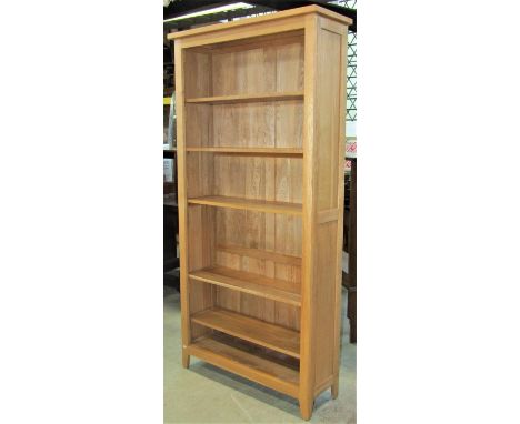 A contemporary light oak freestanding open bookcase, with five adjustable shelves, 92cm wide x 32cm deep x 187cm high 