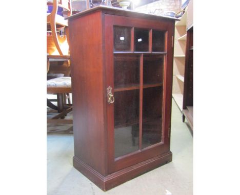 An Edwardian mahogany side cupboard enclosed by a glazed panelled door, with shelf lined interior, 58cm wide x 93cm high