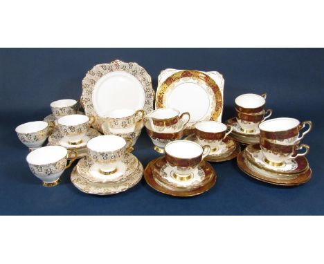 A collection of Royal Stafford teawares in a red and gilt colourway comprising cake plate, milk jug, sugar bowl, six cups, si