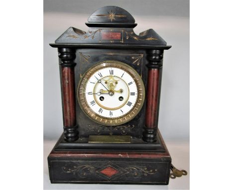19th century black slate twin train mantle clock in architectural case work the enamelled chapter ring with Roman numerals, o