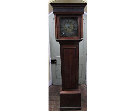 A Georgian oak longcase clock, the door crossbanded in walnut, the square cut hood set beneath a blind fret frieze, enclosing