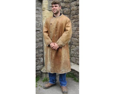 1920's/30's motoring / military coat or duster jacket in soft tan leather; single breasted with button front, pocket holes, r