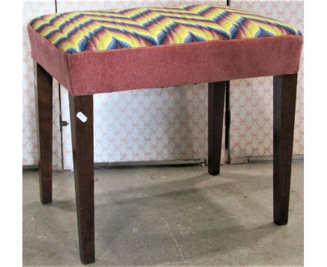 An Edwardian Georgian style stool with rectangular upholstered tapestry seat raised on square tapered supports, 757 cm x 42 c