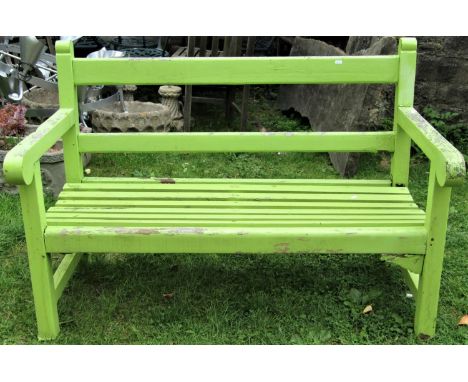 A vintage teak two seat garden bench with slatted seat, rail back and rolled arms with light green painted finish (af) 130cm 