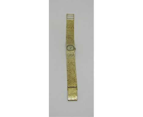 Vintage ladies Ravella 9ct dress watch, the circular dial with gilt baton markers, 15 mm case, quartz movement, 36 grams gros