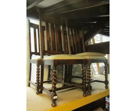 A set of five 1920s oak vertical slat back dining chairs with drop-in upholstered seats raised on barley twist forelegs, unit