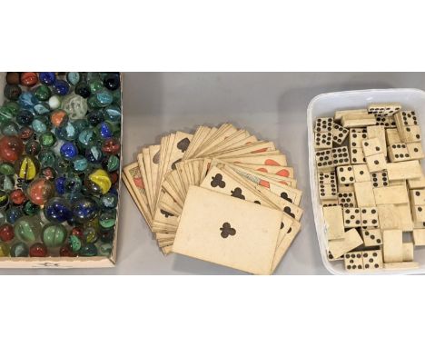 A set of 19th century playing cards of simple form (lacks Ace of Spades), 19th century bonework dominoes and a number of 20th