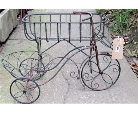 A small novelty light steel and wirework garden planter in the form of a tricycle, together with a further but heavier gauge 