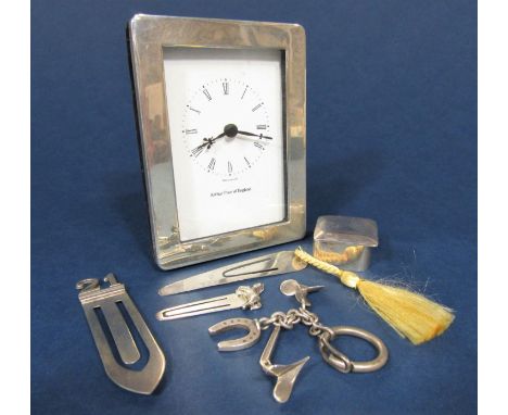 A mixed collection of silver comprising a silver framed Arthur Price of England easel clock, three silver paper clips, silver