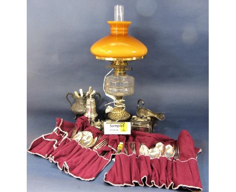 A large collection of mainly cased silver plated flatware, together with further tablewares and a glass and metal oil lamp co