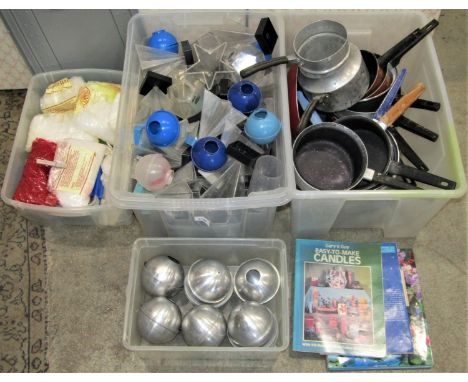 A large quantity of candle making equipment including metal and plastic moulds of varying size and design, 25 kilo sack of pa