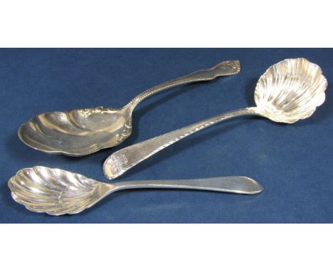 Georgian silver scallop shell sauce ladle together with two further American silver fancy spoons, 5 oz approx (3) 