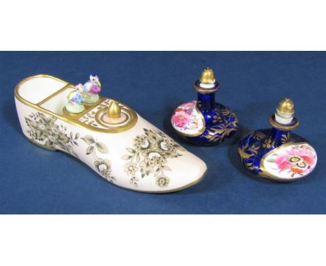 An unusual 19th century continental inkwell in the form of a shoe with monochrome floral decoration on a pale pink ground and