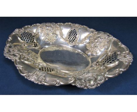 1920s silver Victorian style oval dish, the raised flared rims embossed with floral sprays and diaper panels, maker K B, Lond