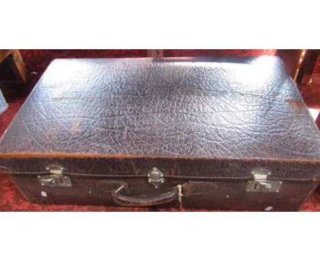 Good large vintage hide travelling trunk, the hinged lid enclosing a trayed tier and fitted interior, 74cm long, and a coracl