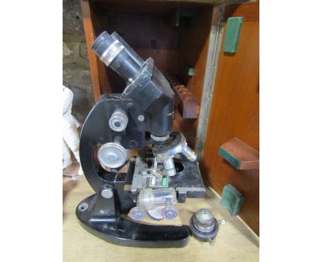 A Vintage Cooke Troughton &amp; Simms black lacquered binocular microscope within a wooden case 