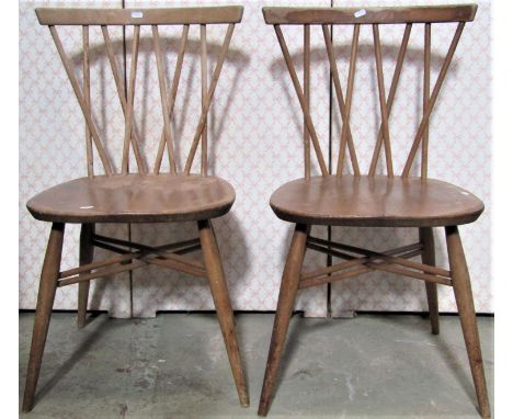 A pair of Ercol dining chairs with interwoven stick backs 