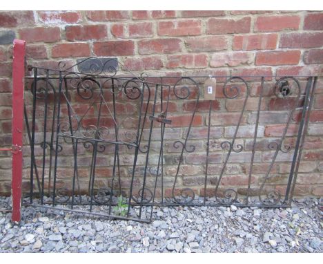 A reclaimed section of iron work railing with repeating scroll work panels 163 cm long x 81 cm high, together with a small as