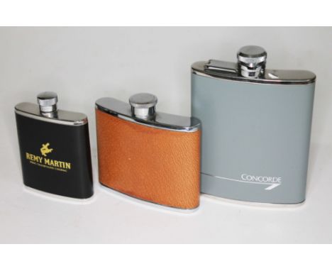 A Concorde hip flask and two others.  